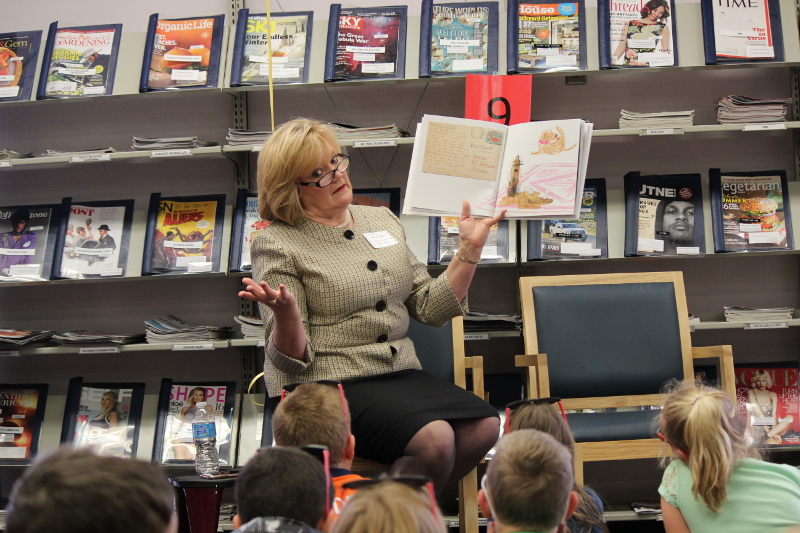 Lisa Scroggins, Natrona County Library Director, reads to a group.