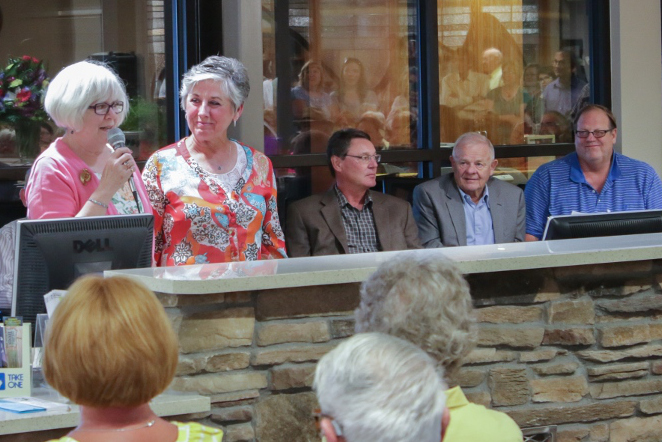 (L to R) Library Director Cynthia Twing and Board Chair Kathy Urruty at the podium. Seated are principal architect Dan Odasz, Johnson County Commissioner Jim Hicks, and Buffalo Mayor Mike Johnson.