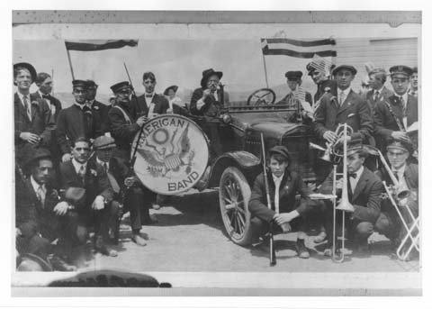 Hanna, Wyoming -- 1920 Labor Day parade: The American Band gathered around a Ford Model "T" with instruments and rifles in hand. Photo from the Wyoming State Archives.