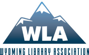 Wyoming Library Association logo has WLA on background of mountains and full name beneath